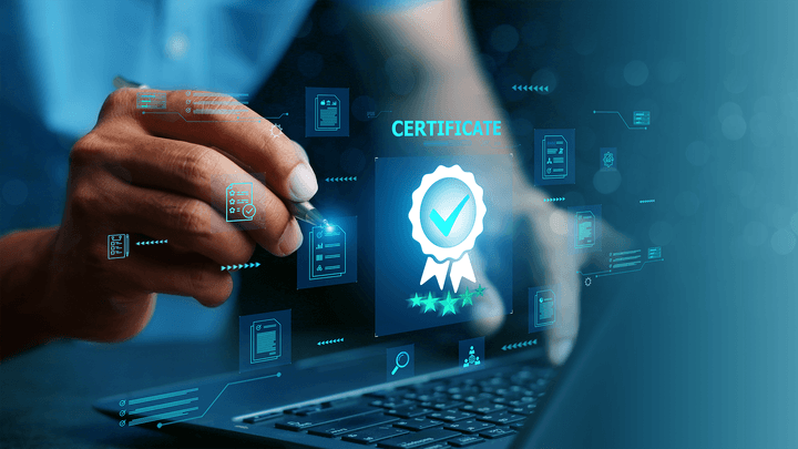 laptop keyboard with certificate hovering over it