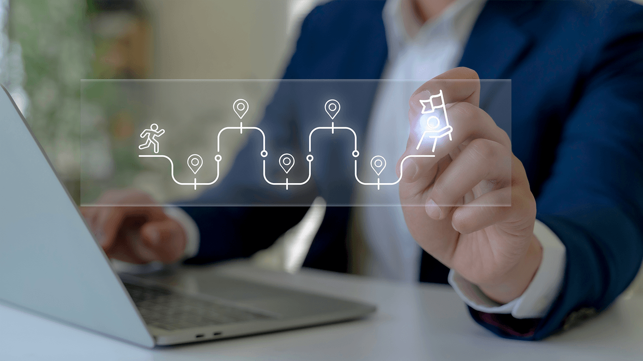 finger choosing icon hovering over laptop