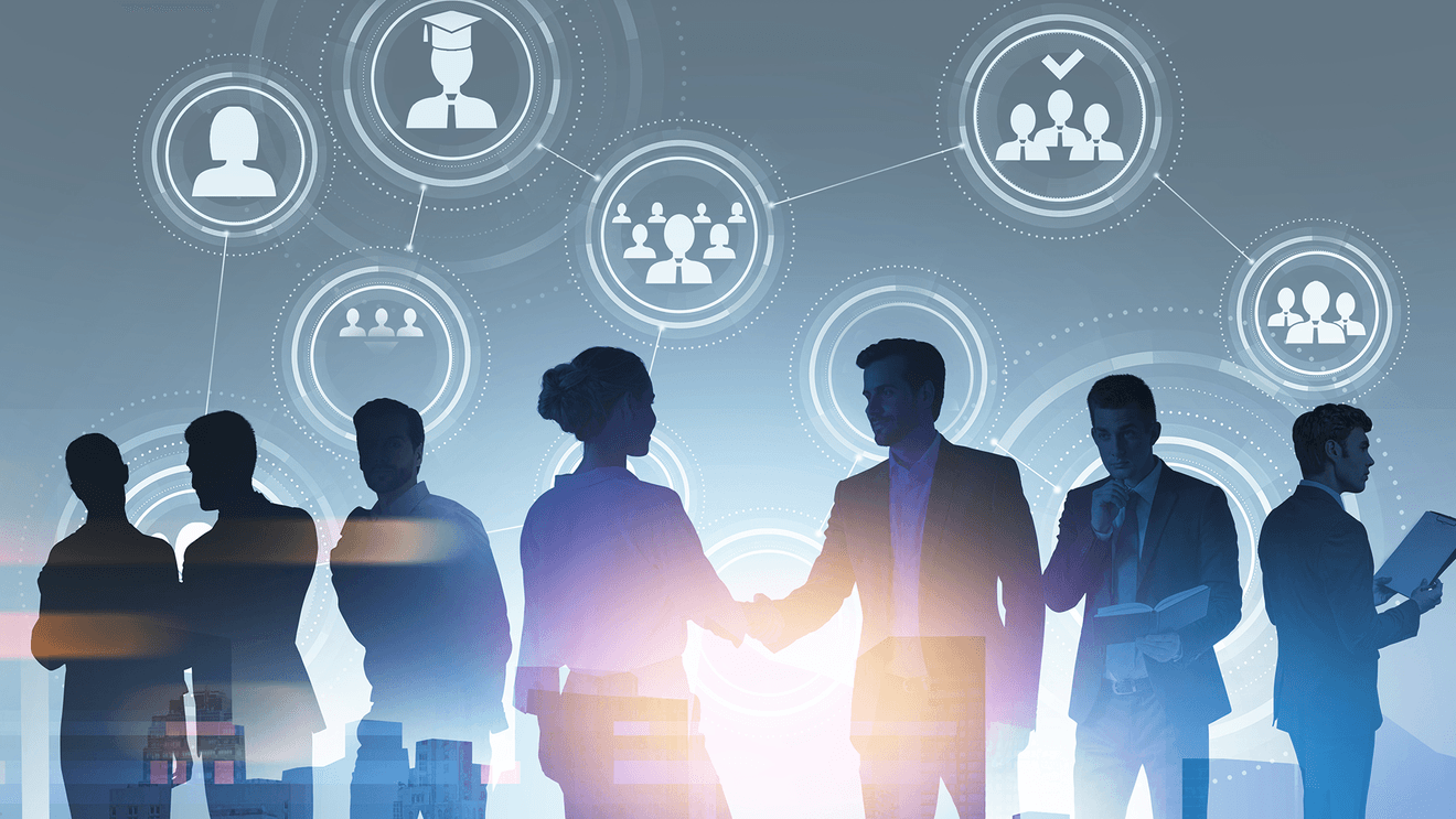 silhouettes of business people shaking hands and on devices with icons floating around